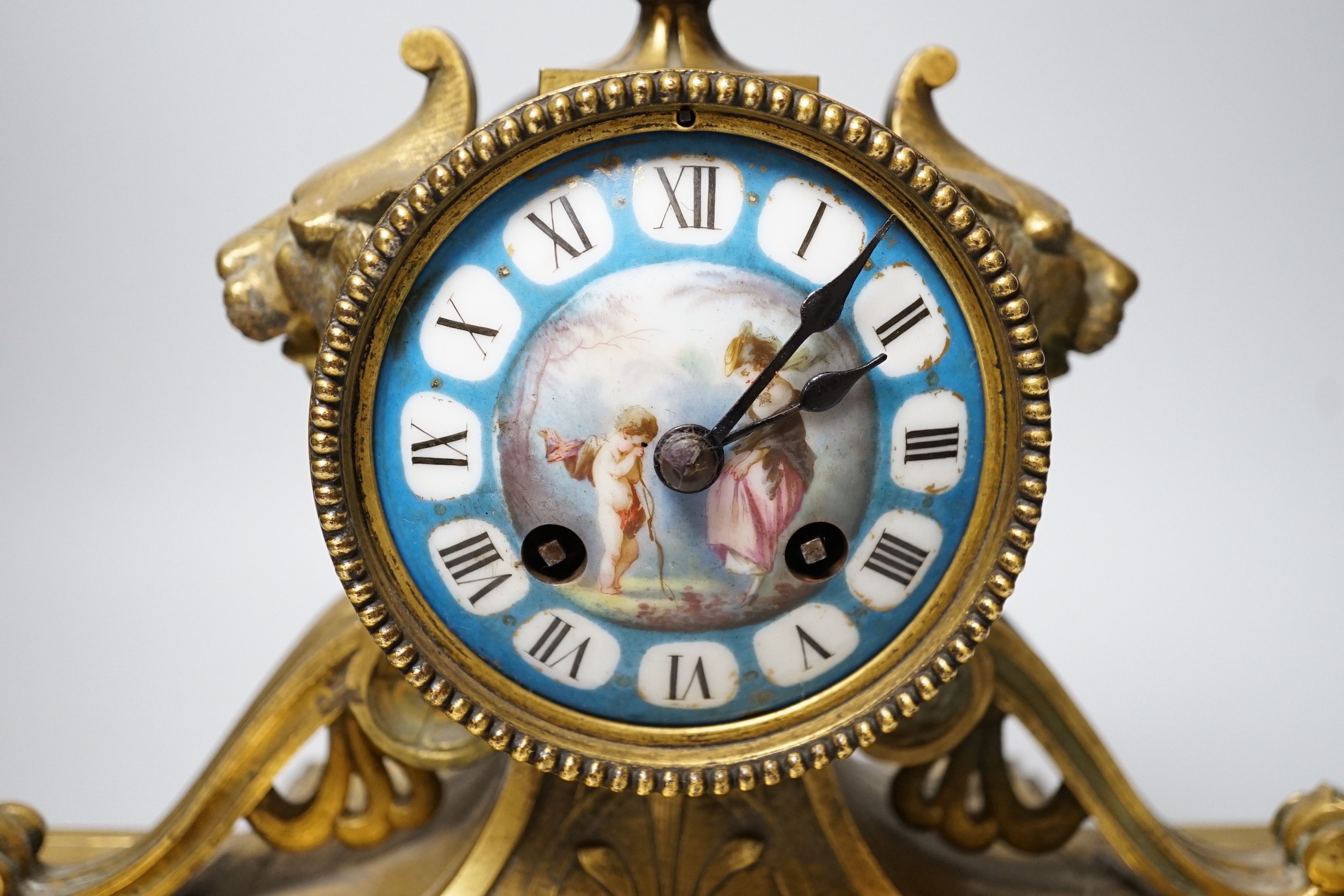 A Sevres style porcelain mounted ormolu mantel clock, 36cms high